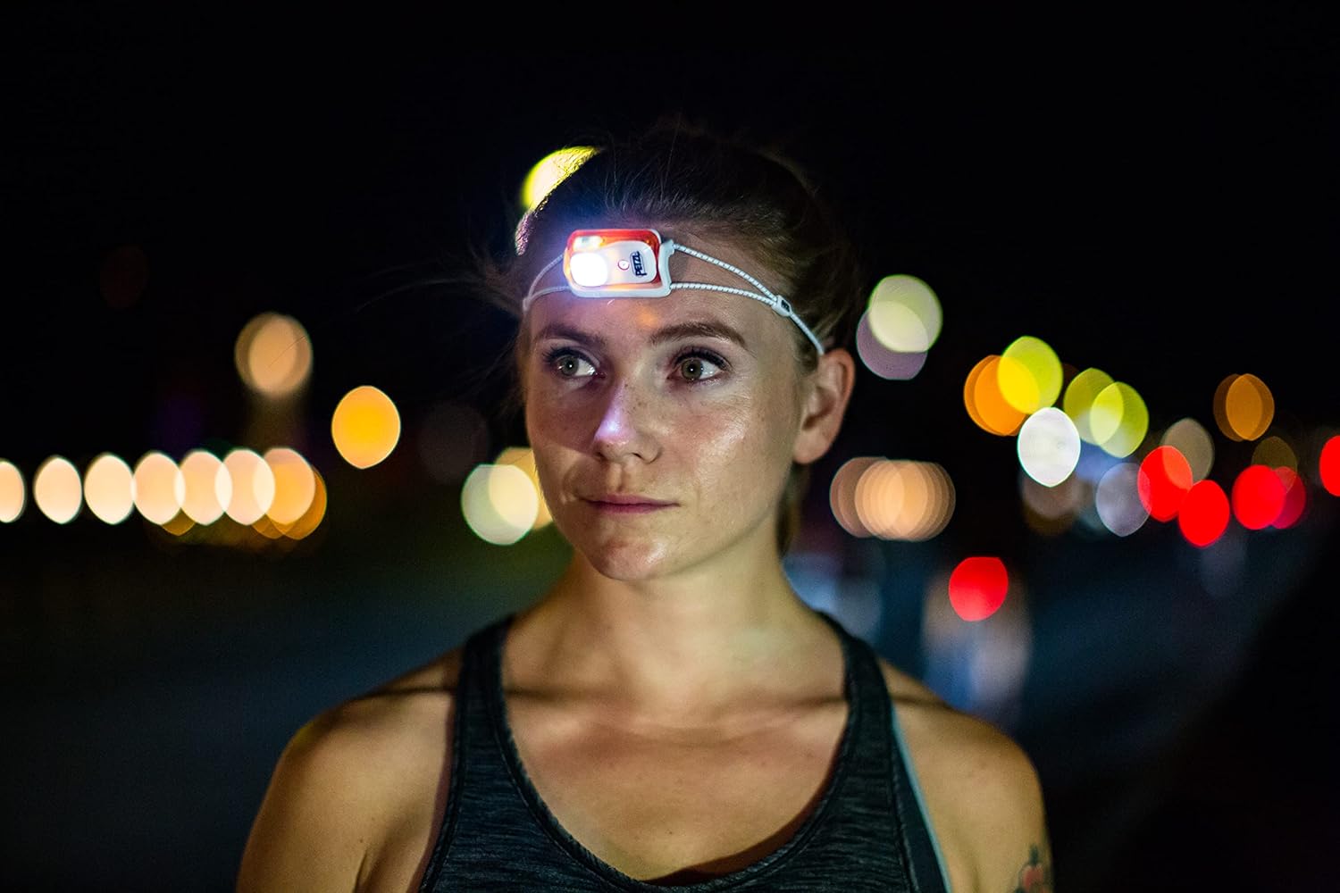 Petzl Bindi Headlamp - compact reYOuRestartable headlamp with 200 lumen - orange